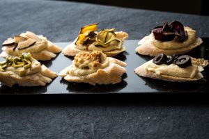 Hummus crostini with assorted toppings