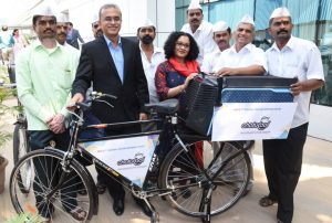 Godrej Appliances presenting customised cycles fitted with Chotukool to Mumbai Dabbawala Association