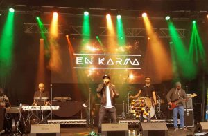 En Karma during a live stage performance