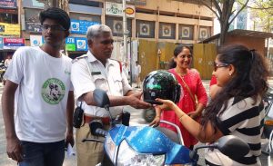 Happy bikers after receiving the helmets - World Head Injury Day
