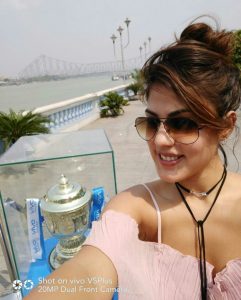 Rhea Chakraborty takes a selfie with the much awaited VIVOIPL Trophy in Kolkata