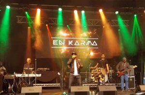 En Karma during a live stage performance